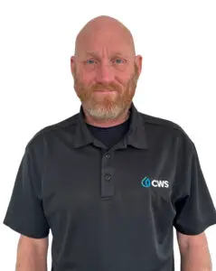 Todd Teas smiling in a black CWS shirt