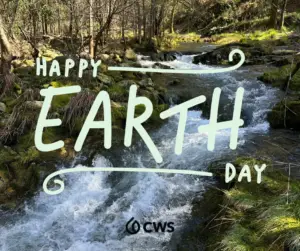 A photo of a creek in the woods with the text "Happy Earth Day" over it, along with the CWS logo in black at the bottom.